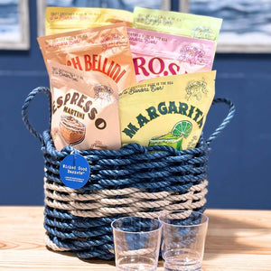 Coastal Cocktail Gift Basket featuring frozen drink mixes in a nautical blue with silver stripe lobster rope basket with personalized tumblers – perfect beach-themed cocktail gift for summer parties and seaside entertaining.