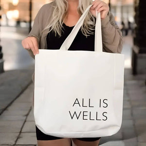 ALL IS WELLS™ canvas tote bag inspired by coastal living, made of durable polyester canvas with reinforced stitching and spacious design for everyday use.