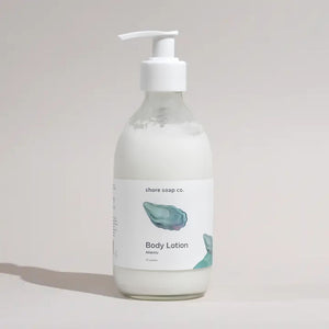 Atlantic Body Lotion with Glass Pump and Oyster Shell Design Styled in Soft Natural Light, Coastal Bath and Body Product