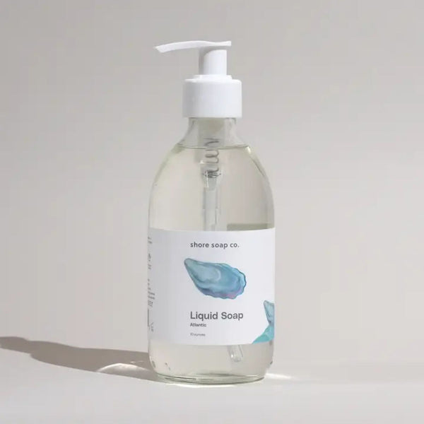 Atlantic Liquid Hand Soap with Glass Pump and Oyster Shell Label Styled in Soft Natural Light, Coastal Bath Product