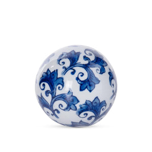 Decorative blue and white ceramic ball with classic floral motif, perfect for bowls, shelves, or tabletop styling.