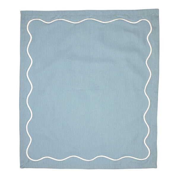Blue cotton napkin with white embroidered scalloped border.