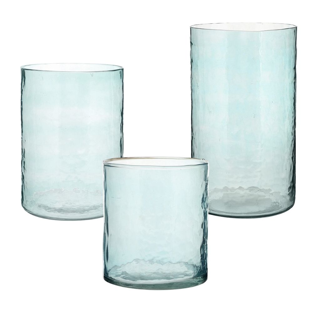 Blue hammered glass hurricane candle holders with candles