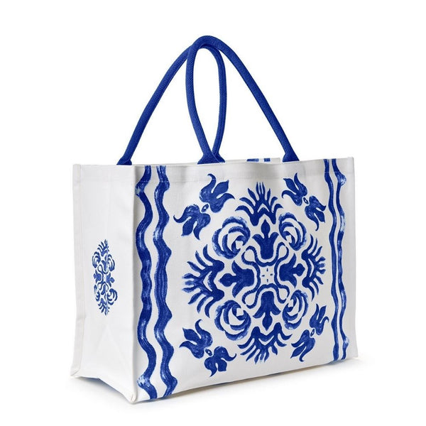 Blue tile print cotton canvas tote bag with roomy interior and zip pocket, combining coastal charm and everyday functionality.