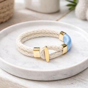 Gold-accented rope bracelet inspired by coastal style, comfortable for everyday wear or layering.