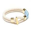 Gold-accented rope bracelet inspired by coastal style, comfortable for everyday wear or layering.