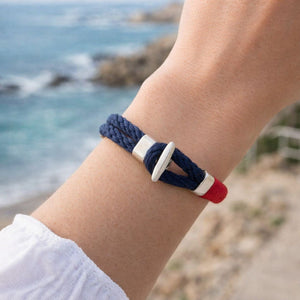 Comfortable cotton rope bracelet with silver-plated hardware, styled with layered jewelry