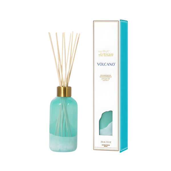 8 oz Capri Blue Volcano diffuser with teal glass bottle, gold lid, and reeds, boxed.