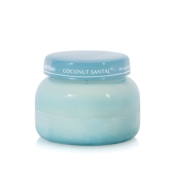 Soy-blend Coconut Santal wax candle with coconut, amber, lime, and hibiscus notes, poured in a light teal glass jar, 19 oz.