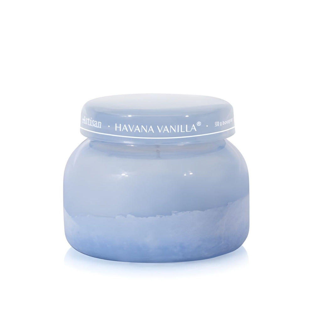 Soy-blend Havana Vanilla wax candle with vanilla, tobacco, bergamot, and sandalwood notes in a periwinkle blue glass jar, 19 oz.
