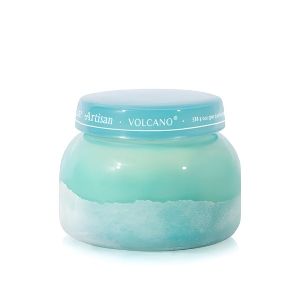 Soy-blend Volcano wax candle with bright citrus and sweet notes, poured in a teal glass jar, 19 oz.