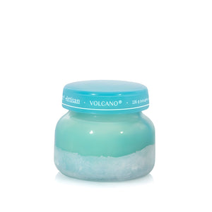 Soy-blend Volcano wax candle with bright citrus and sweet notes, poured in a teal glass jar, 8oz.
