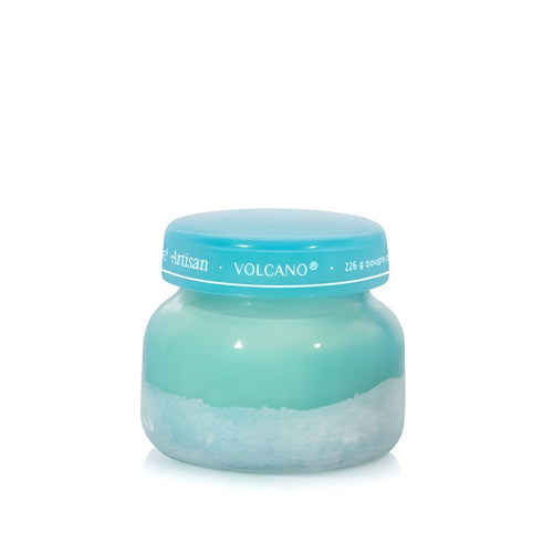 Soy-blend Volcano wax candle with bright citrus and sweet notes, poured in a teal glass jar, 8oz.