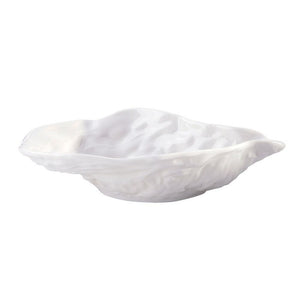 Ceramic oyster shell shaped bowl with scalloped edge and glossy white finish