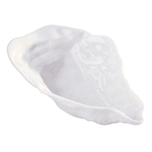 Side view of ceramic oyster shell serving bowl with textured rim