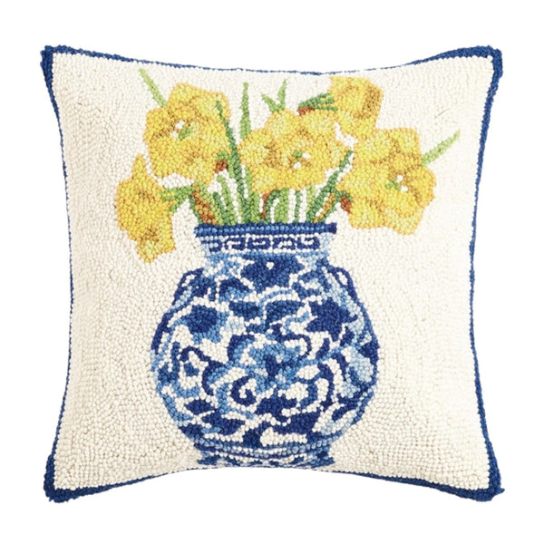 A square 16 x 16 hand-hooked wool pillow featuring a blue-and-white patterned ginger jar filled with bright yellow daffodils on a cream background.