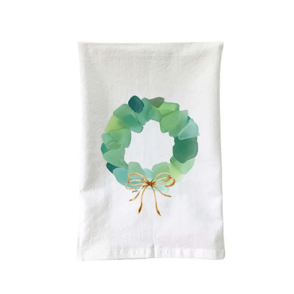 Coastal-themed flour sack towel with
sea glass wreath design and soft cotton material