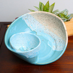 Set of coastal swirly ceramic bowls featuring soft ocean-inspired blue and white marbling, ideal for serving or display. Each handcrafted bowl has a smooth glazed finish with subtle variations in pattern, bringing a serene, beachy elegance to any table or shelf.