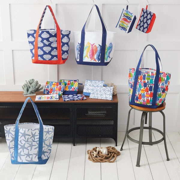 Colorful tote bags with various patterns on a white floor and wooden furniture.