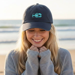 Navy cotton hat with an embroidered teal lobster design and adjustable hook-and-loop strap