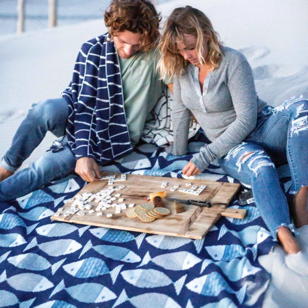 Eco-friendly Big Fish throw blanket, 50x60 inches, made from recycled cotton and polyester, perfect for coastal-style homes and cozy lounging.