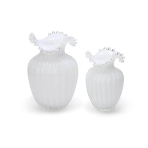 Decorative white glass vases with pearlescent shine, adding a touch of sophistication to any room