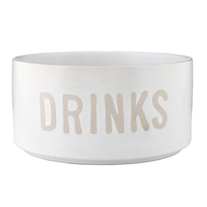 Stoneware pet bowl with debossed “Drinks” text