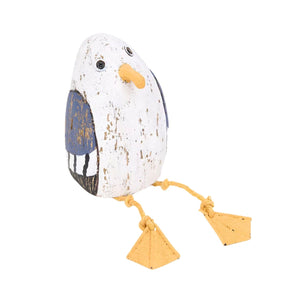 Small distressed wooden seagull, featuring a compact design and a vintage, sea-worn look with rope legs.
