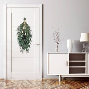 Festive greenery swag made of juniper and eucalyptus with bells for Christmas décor, 28" x 5" x 10" seasonal home decor