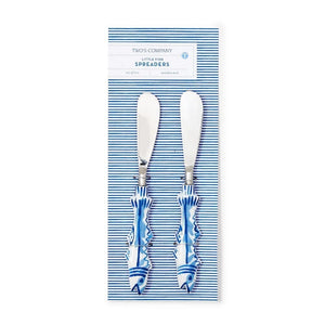 Set of two coastal-themed fish handle spreaders made of stainless steel, aluminum, and enamel, perfect for serving cheese, butter, or dips with seaside charm.