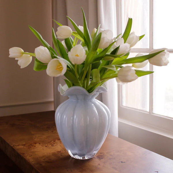 Large periwinkle blue glass vase with a hand-painted interior, showcasing subtle variations that make each piece unique.