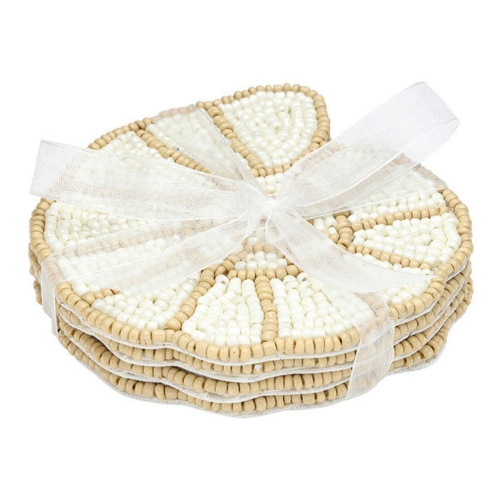 Set of four beaded shell coasters tied with ribbon made from neutral toned glass beads