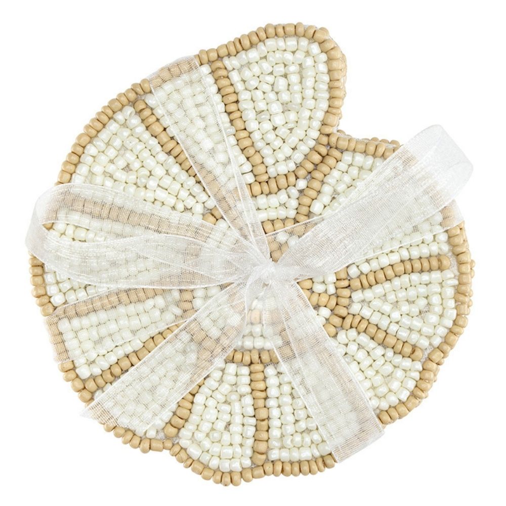 Set of four beaded shell coasters tied with ribbon made from neutral toned glass beads