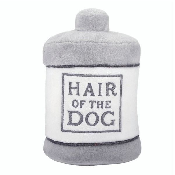 Plush dog toy shaped like a bottle with Hair of the Dog text
