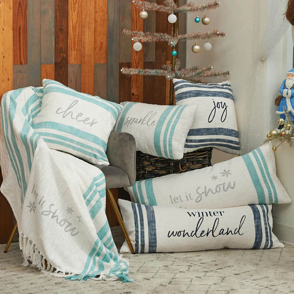 Seasonal oversized pillow in cotton with timeless stripes and a playful winter message.”