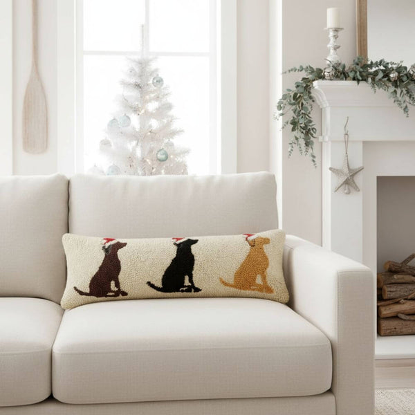 A festive rectangular Labrador pillow featuring a wool-hooked design of a dog wearing a Santa hat, accented with a soft velvet back. Perfect as a cozy holiday accent for sofas, chairs, or entry benches.