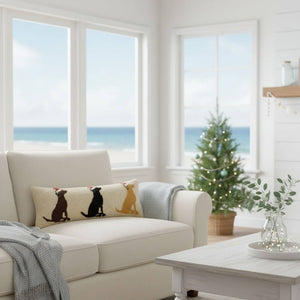 Holiday-themed decorative pillow showing a cheerful Labrador in a Santa hat, crafted with a wool-hooked texture and velvet backing. Ideal for adding warmth and charm to your seasonal home décor.