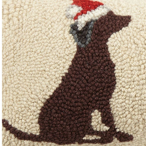 Textured hooked pillow with brown dog silhouette wearing a red and white Santa hat on beige background, festive dog-themed Christmas décor accent for sofa or living room