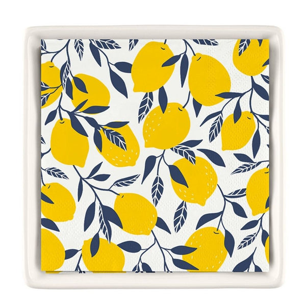Lemon cocktail napkin set inside a ceramic tray