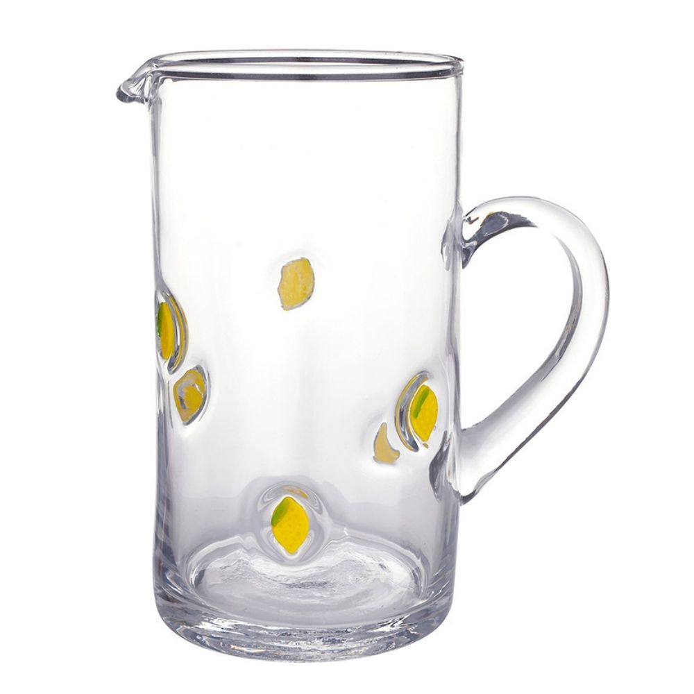 Clear glass pitcher with small lemon illustrations and handle for serving beverages