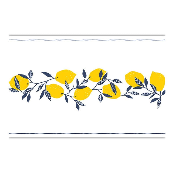 Close-up of lemon and blue leaf design on paper table runner