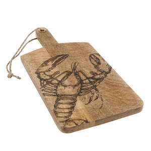 Angled view of rectangular mango wood serving board with handle and etched lobster design