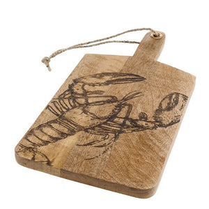 Angled view of rectangular mango wood serving board with handle and etched lobster design