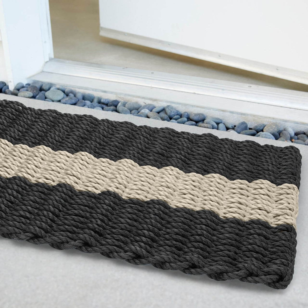 Lobster Rope Doormats, Outdoor Door Mats, Wicked Good Door Mats Made in Maine, Black with Dark Tan Stripe, Angled View in Front Door