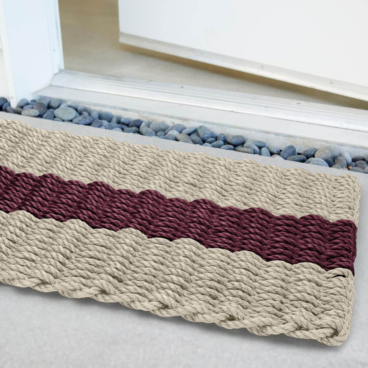 Lobster Rope Doormats, Outdoor Door Mats, Wicked Good Door Mats Made in Maine, Dark Tan with Cranberry Stripe, Angled View in Front Door