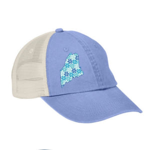 Blue and beige cap with floral Maine state design on a white background