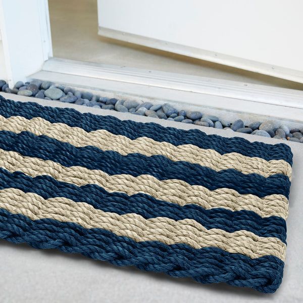 Weatherproof, heavy-duty outdoor mat with modern stripe pattern and coastal sophistication.