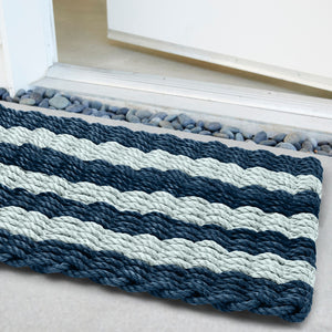Weatherproof striped doormat combining coastal charm with modern sophistication