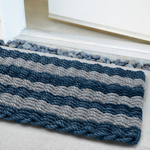 Resort-inspired striped doormat built to withstand coastal elements and heavy use