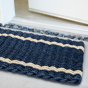 Weatherproof and fade-resistant doormat with subtle stripe pattern, crafted for year-round outdoor use.